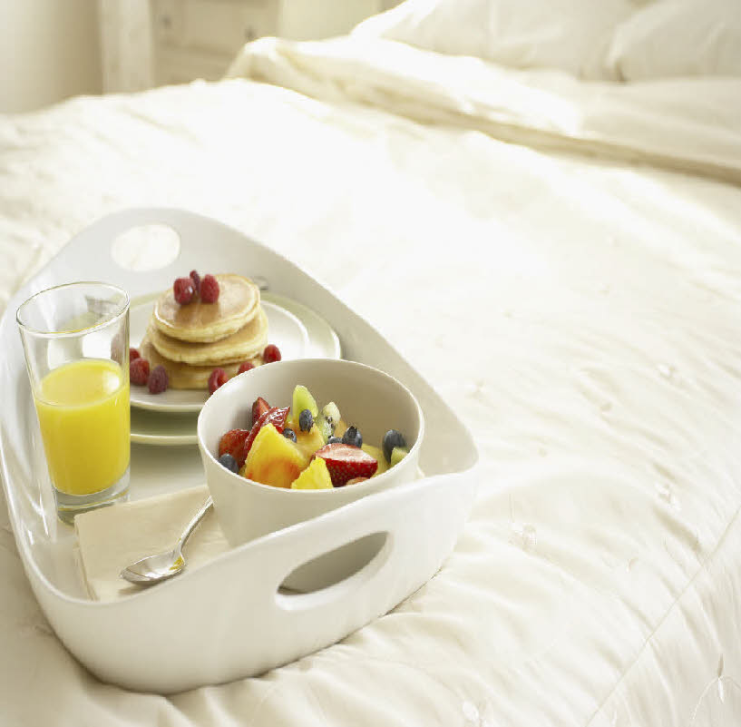 background image of breakfast on bed